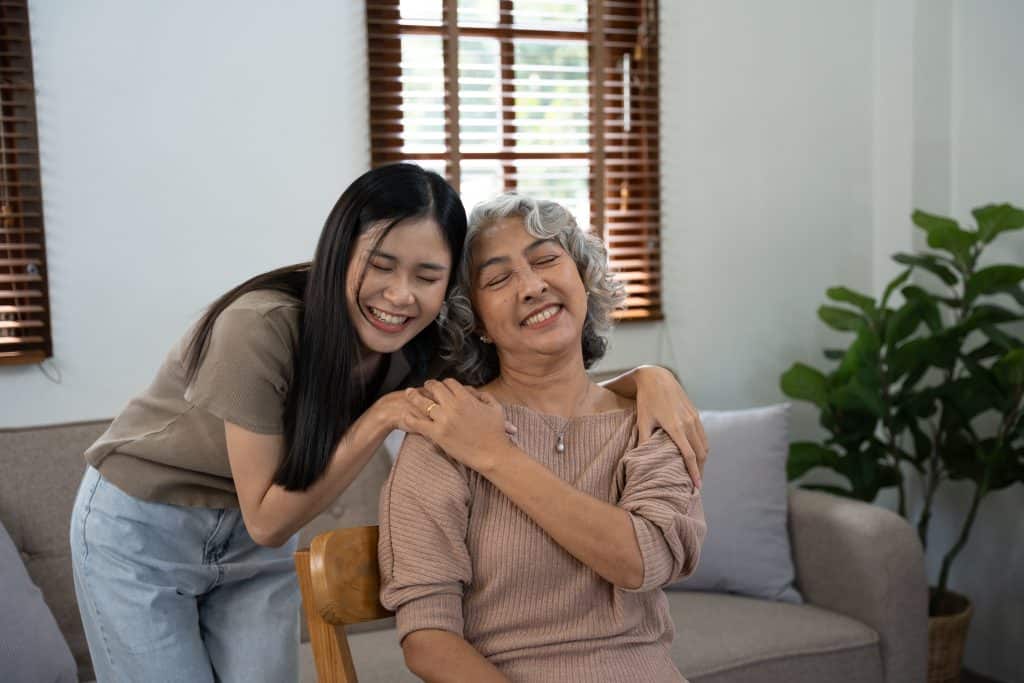 Elderly care and insurance concept, Happy elderly woman with her daughter at home.